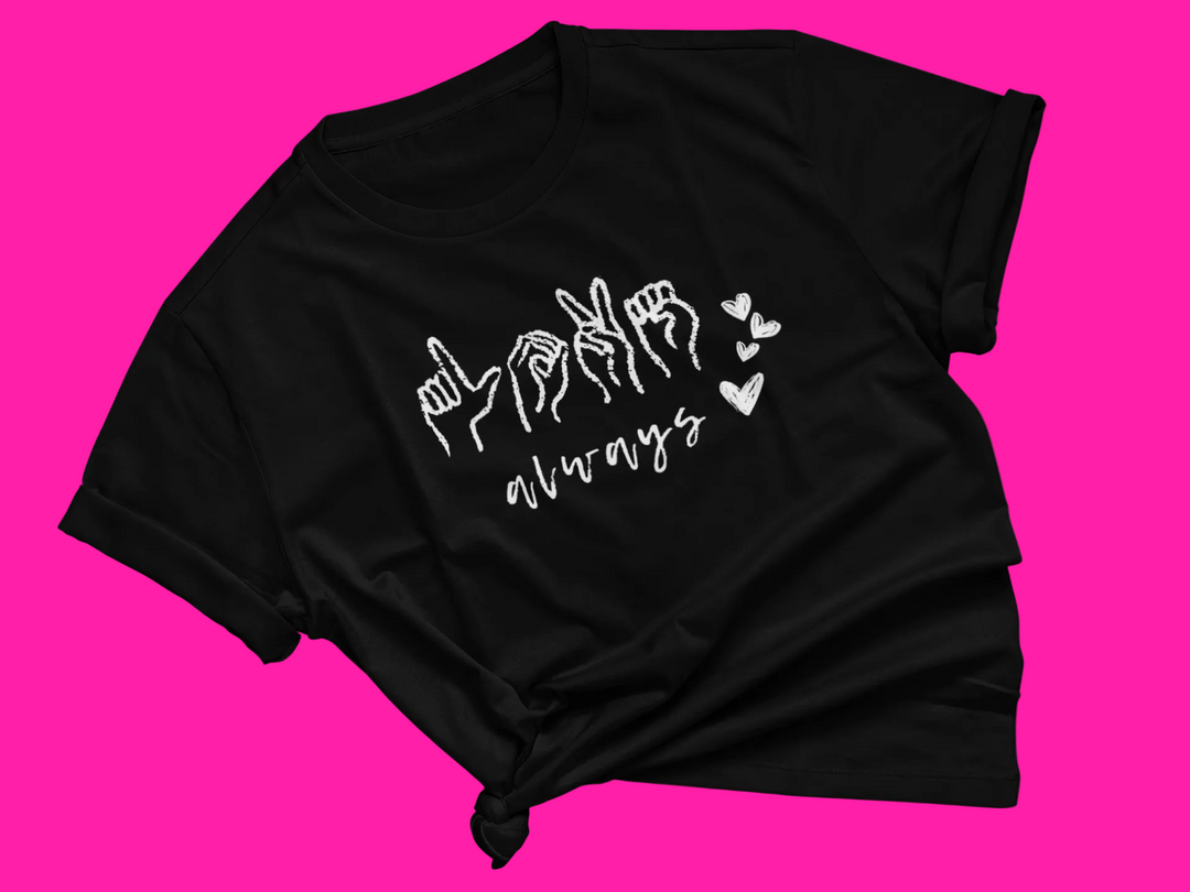Black t-shirt with white text "Love Always" and four heart symbols on a pink background